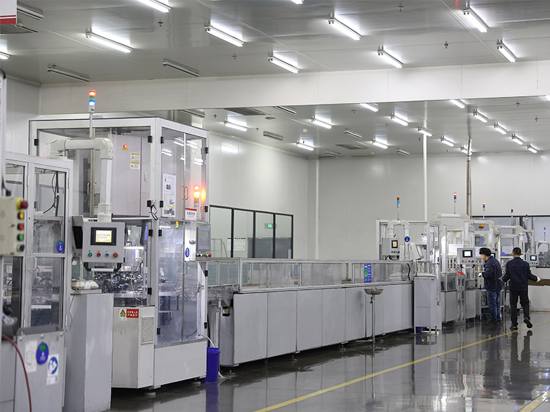 Automated battery production line in a clean modern factory with conveyor system and precision manufacturing equipment